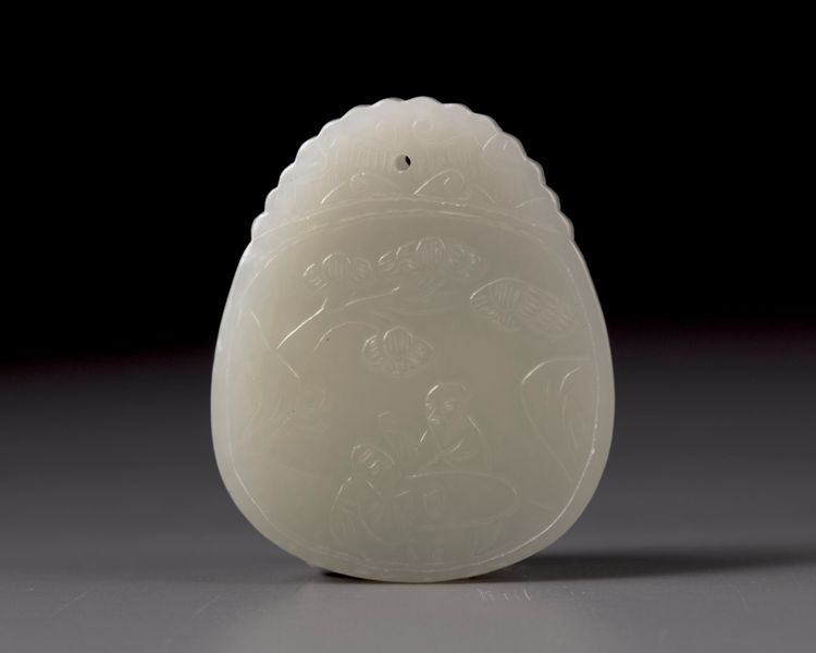 A Chinese white jade 'scholar and pine' plaque