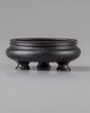 A Chinese bronze tripod censer