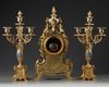 A FRENCH CHAMPLEVÉ ENAMEL CLOCK SET, 19TH CENTURY