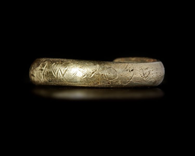 AN ELECTRUM RING WITH PHOENICIAN INSCRIPTION, 6-7TH CENTURY BC
