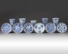 A group of eleven Chinese blue and white cups and saucers