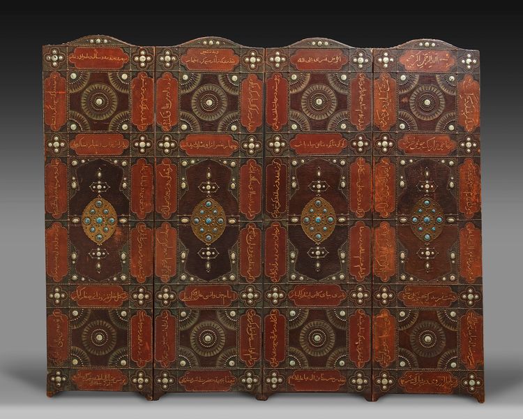 A FOUR PANEL LEATHER SCREEN, DATED 1346 AH /1927-28 AD