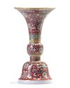 A Chinese ruby-ground famille rose 'bajixiang' gu vase
