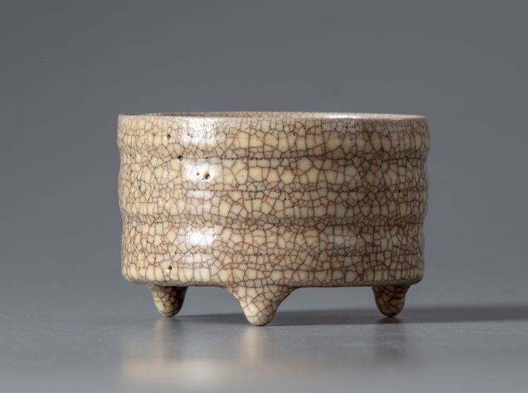 A Chinese crackle-glazed tripod censer