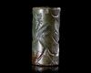 A GREEN CHALCEDONY CYLINDER SEAL, CIRCA 8TH-7TH CENTURY BC