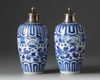 A pair of silver-mounted Chinese blue and white ovoid vases and covers