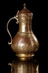AN OTTOMAN GILT-COPPER (TOMBAK) BOZALIK (BOZA EWER), TURKEY, DATED 1194 AH/1780 AD