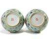 A pair of Chinese famille rose celadon-ground slip-decorated bottle vases