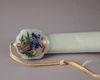 A Chinese hardstone-inlaid pale celadon jade ruyi sceptre