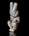 A GREENISH-YELLOW JADE OF A HUMANOID FIGURE, CHINA, HONGSHAN CULTURE