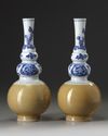 A pair of Chinese café-au-lait-glazed blue and white triple gourd vases