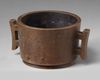 A CHINESE BRONZE TWIN-HANDLED CENSER