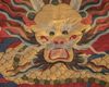 A Chinese red-ground kesi 'dragon' panel