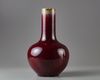 A red glazed bottle vase