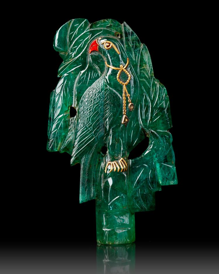 A  MUGHAL CARVED EMERALD DEPICTING A PARROT IN A TREE, 19TH CENTURY