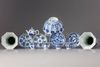 A lot of twelve blue and white items