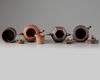 Three Chinese Yixing teapots and a Yixing brush pot