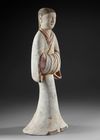 A LARGE TERRACOTTA STATUE OF A STANDING FEMALE ATTENDANT, CHINA, HAN DYNASTY (206 BC-206 AD)