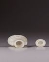 A small Chinese white jade flattened baluster vase and cover