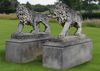 A PAIR OF MONUMENTAL SCULPTED LIMESTONE MODELS OF PROWLING LIONS, 20TH CENTURY