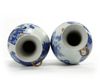 A matched pair of Chinese blue and white twin-handled slender vases