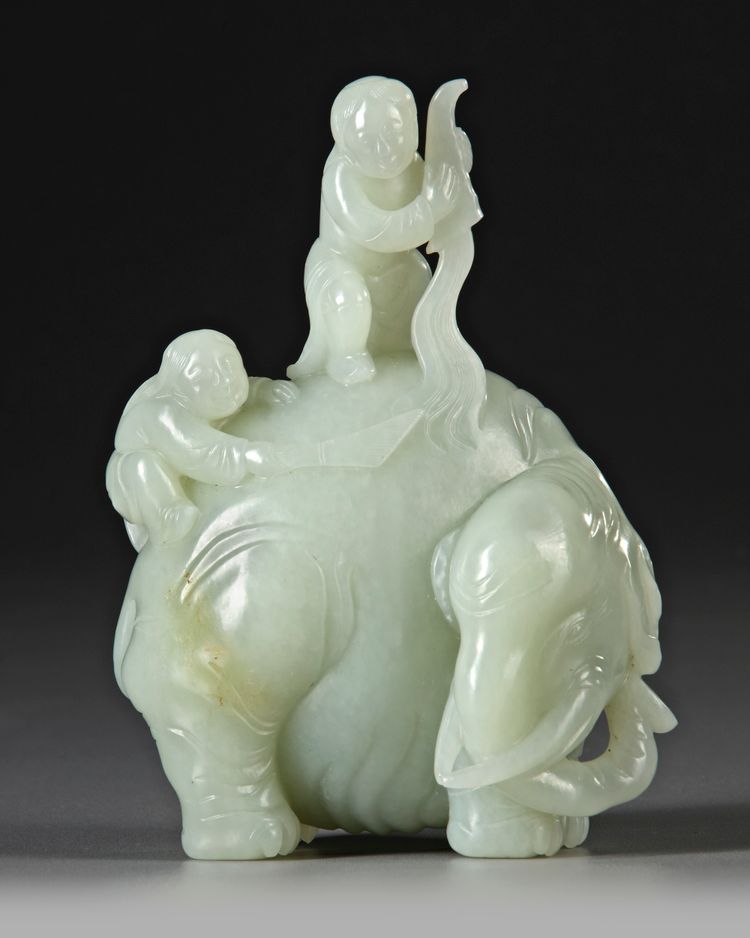 A CELADON JADE CARVING OF TWO BOYS WASHING AN ELEPHANT, 19TH CENTURY