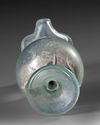 A ROMAN PALE GREEN GLASS EWER, CIRCA 1ST–3RD CENTURY A.D.