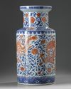 A large Chinese iron-red-decorated blue and white 'dragon and phoenix' rouleau vase