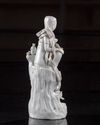A CHINESE DEHUA GLAZED FIGURE OF GUANYIN AND A BOY, QING DYNASTY (1644-1911)