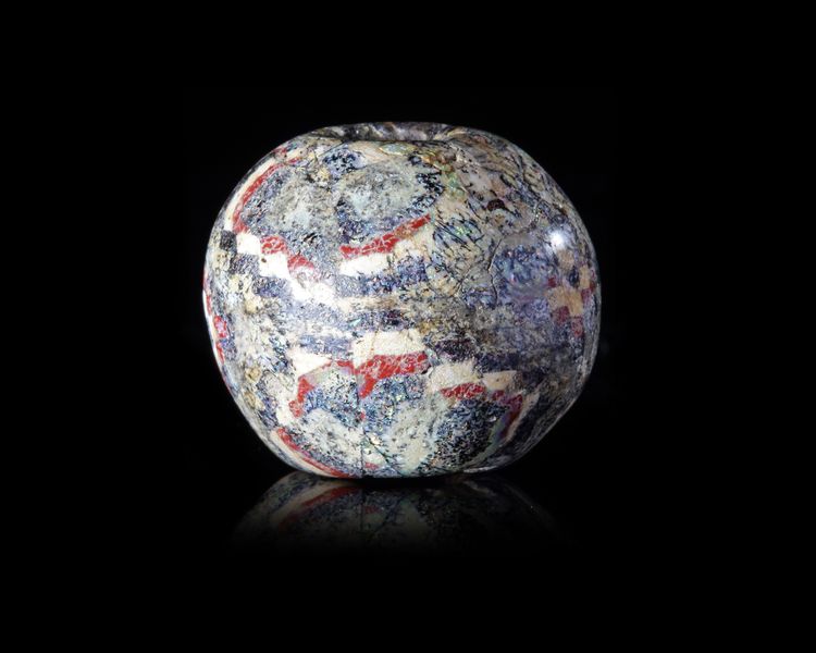 A LARGE SPHERICAL MOSAIC GLASS BEAD, ROMAN 1ST CENTURY AD