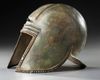 A GREEK BRONZE ILLYRIAN HELMET, CIRCA 6TH-5TH CENTURY B.C.