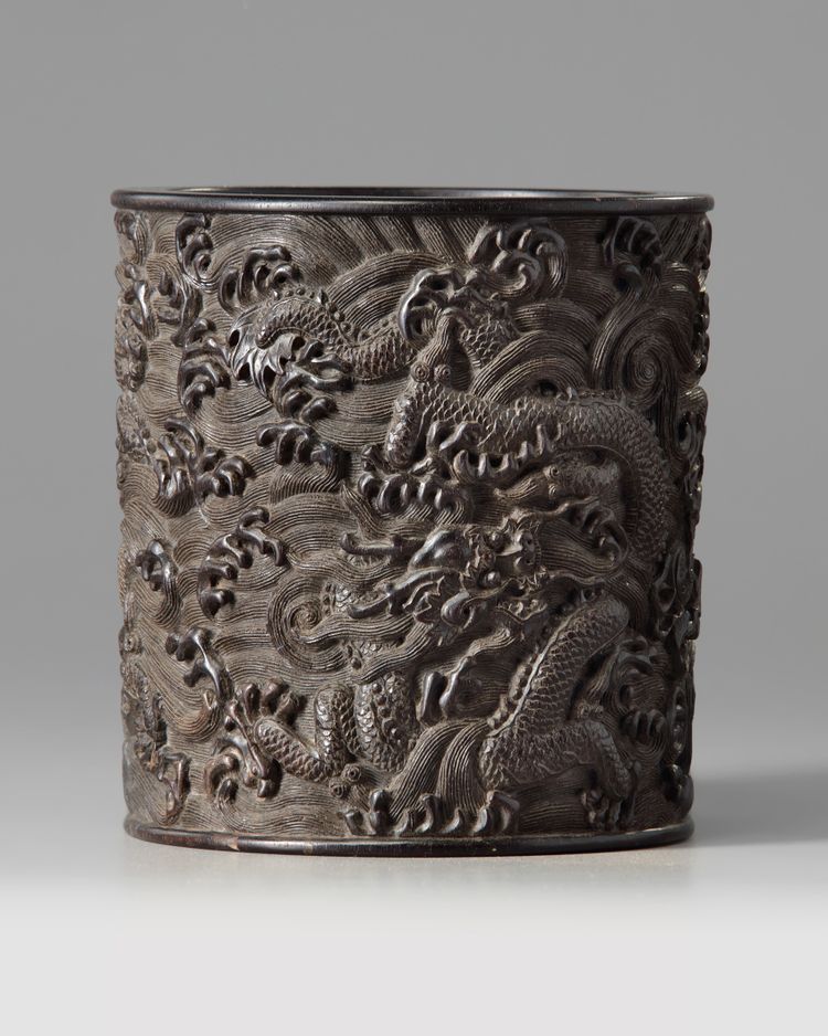 A Chinese zitan ‘dragon and waves’ brush pot, bitong