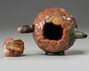 A Chinese Yixing green with brown-clay 'lotus & butterfly' teapot