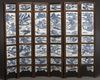 A Chinese six-fold screen inset with blue and white panels