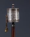 A MONGOLIAN SILVER PRAYER WHEEL, 19TH CENTURY