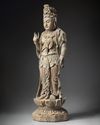 A LARGE CHINESE POLYCHROME-DECORATED WOOD CARVING OF GUANYIN, POSSIBLY SONG-YUAN DYNASTY