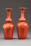 A matched pair of Chinese coral red-decorated double gourd vases