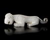 A CHINESE WHITE JADE TIGER, SHANG DYNASTY (CIRCA 1600–1046 BC)