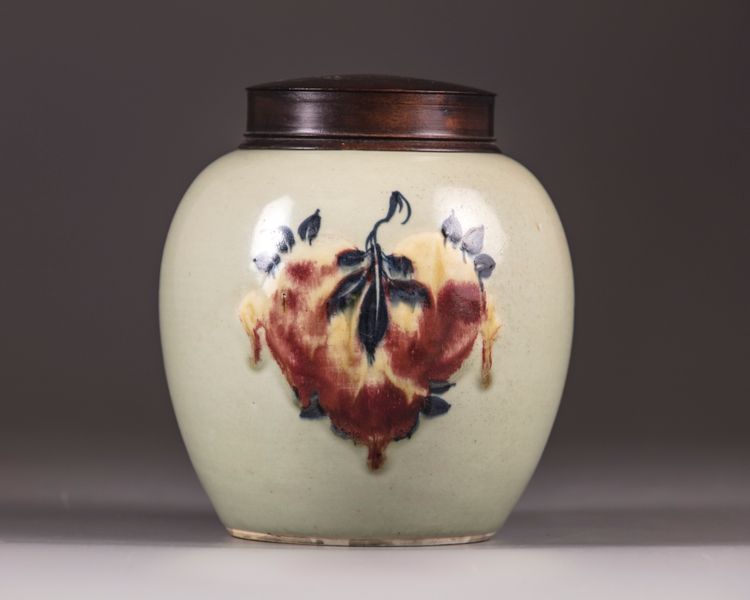 A Chinese celadon-ground 'nine peaches' ovoid jar