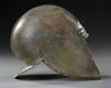 A GREEK BRONZE ILLYRIAN HELMET, CIRCA 6TH-5TH CENTURY B.C.