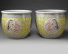 A pair of Chinese famille rose 'dragon and phoenix' jardinieres