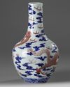 A CHINESE UNDERGLAZE COPPER-RED AND BLUE DECORATED  'DRAGON' VASE