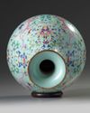 A Chinese turquoise-ground famille rose 'dragon and phoenix' vase