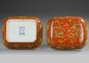 A CHINESE YELLOW-DECORATED RED-GROUND DRAGONS BOX AND COVER, QING DYNASTY (1644–1911)