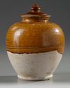 A CHINESE AMBER-GLAZED JAR AND COVER, TANG DYNASTY (618-907)