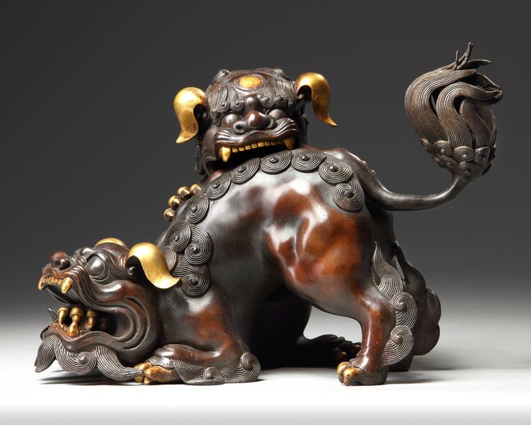 A PARCEL GILT CHINESE BUDDHIST LION FORM CENSER, 20TH CENTURY