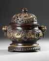 A CHINESE PARCEL-GILT BRONZE 'SEA CREATURES' CENSER, COVER AND STAND