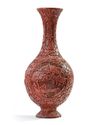 A Chinese carved cinnabar lacquer slender vase