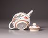 A Chinese Dutch-decorated carved-surface 'three friends of winter' teapot