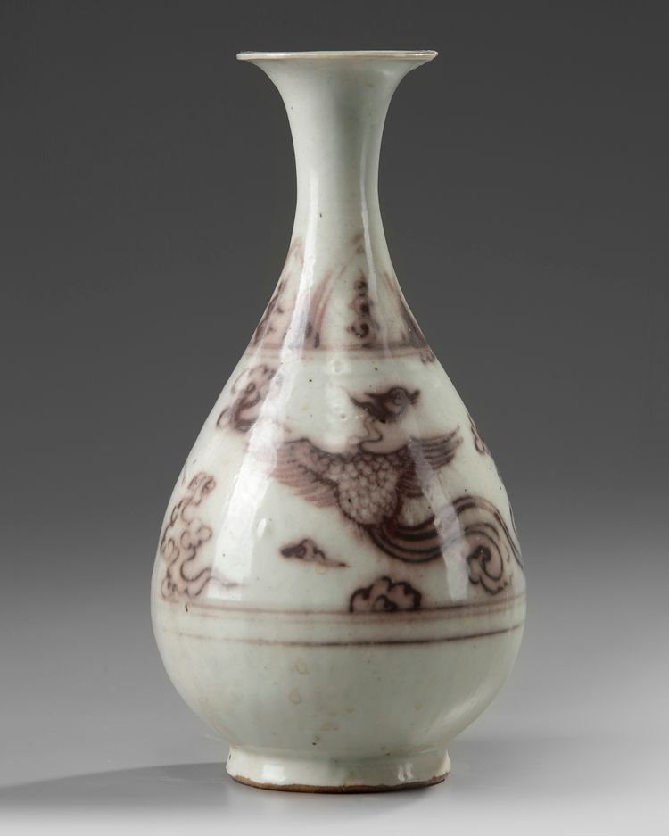 A Chinese Ming-style underglaze copper red 'phoenix' pear-shaped vase, yuhuchunping